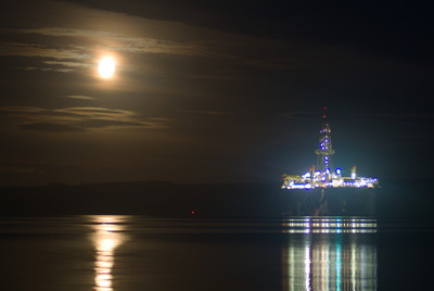 The Moon and an oil rig across the Cromarty Firth